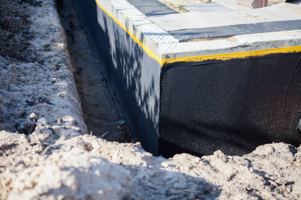 Professional Waterproofing technician working in Munith, MI